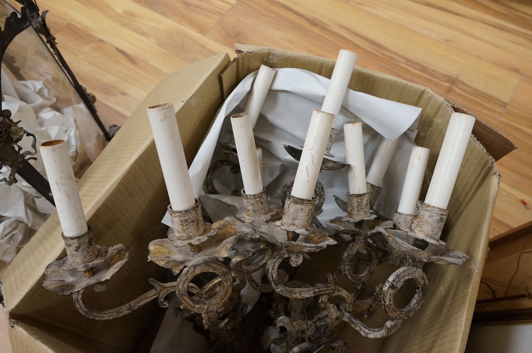 Four French decorative metal two branch wall sconces, 63cm high including faux candle attachments, including silk shades